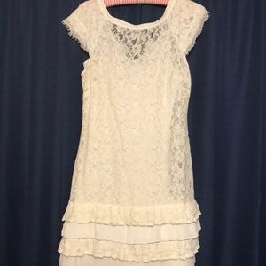 White lace dress with ruffle skirt
